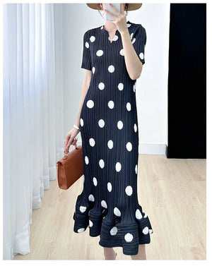 Black polka dot pleated dress